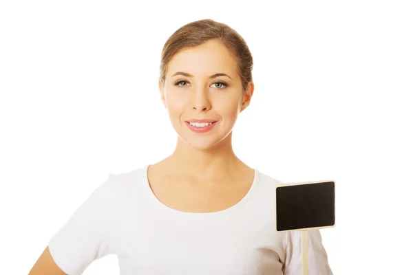 Woman holding a small panel — Stock Photo, Image