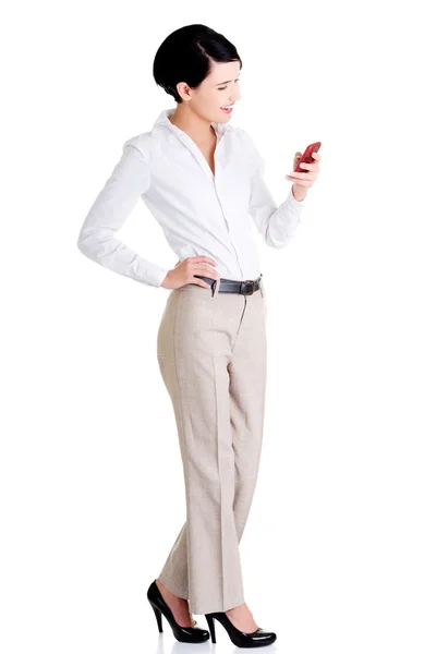 Businesswoman using mobile phone — Stock Photo, Image