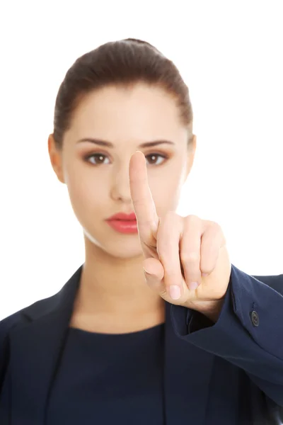 Affärskvinna pekar med ett finger — Stockfoto