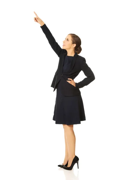 Businesswoman pointing up Stock Picture