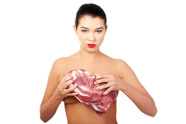 Naked woman holding beef — Stock Photo, Image