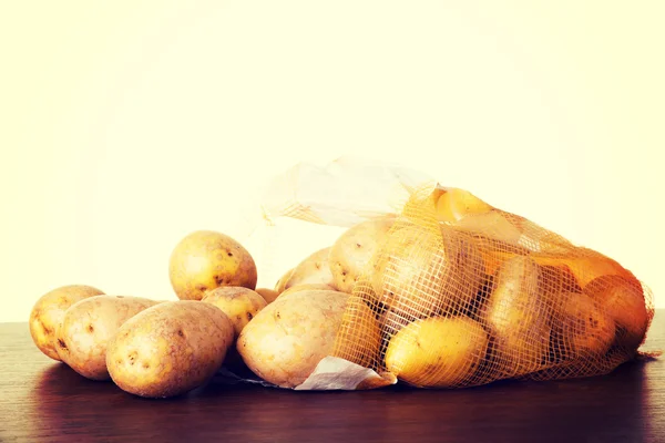 Fresh potatoes in a sack. — Stock Photo, Image