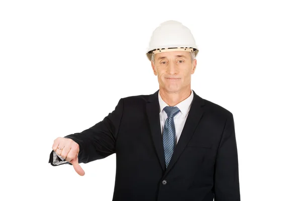 Construcción hombre de negocios mostrando el pulgar hacia abajo signo — Foto de Stock