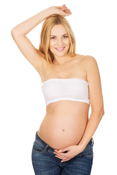 Zwangere vrouw kijken camera — Stockfoto