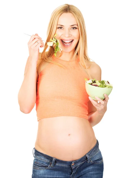 Mulher grávida comendo salada — Fotografia de Stock