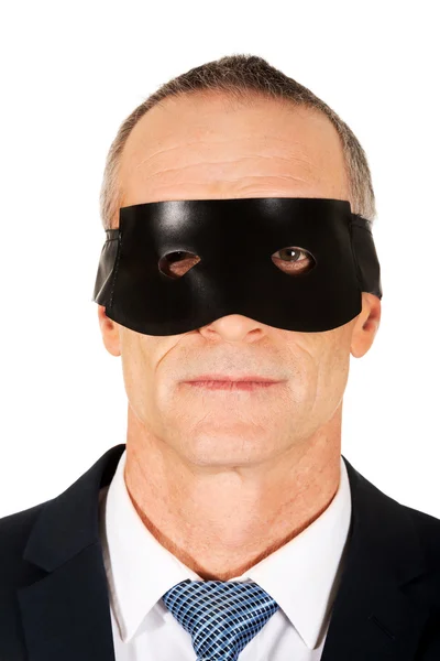 Empresário em máscara de olho preto — Fotografia de Stock