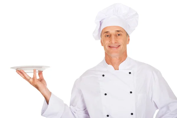 Chef in possesso di piatto bianco — Foto Stock