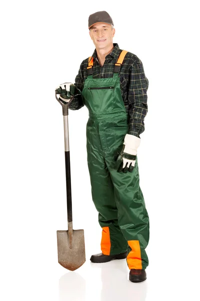 Mature gardener with a spade — Stock Photo, Image