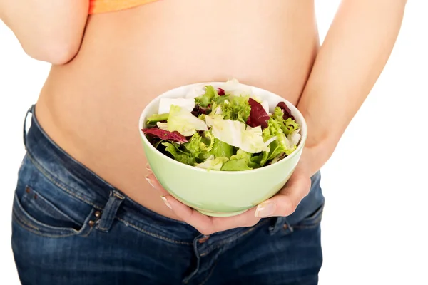 Pregnant woman with bowl with salad — Stock Photo, Image