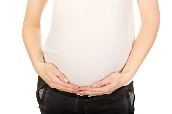 Zwanger vrouw houden haar buik — Stockfoto