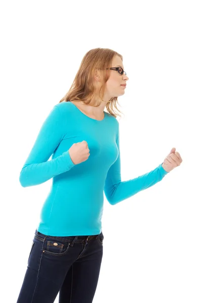 Angry teenage woman making fists — Stock Photo, Image