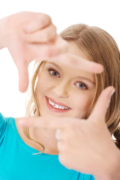 Woman creating frame with fingers — Stock Photo, Image
