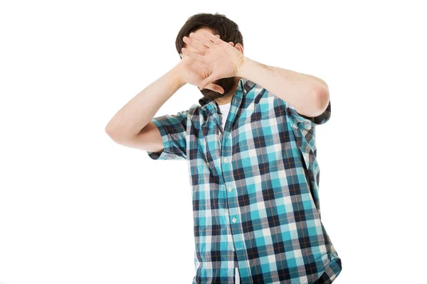 Afraid man covering his face. — Stock Photo, Image