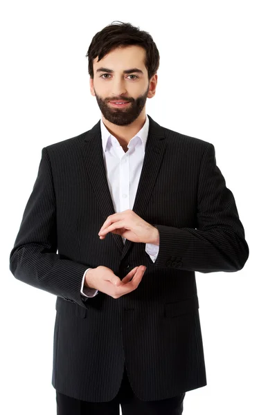 Businessman showing the size with hands. — Stock Photo, Image