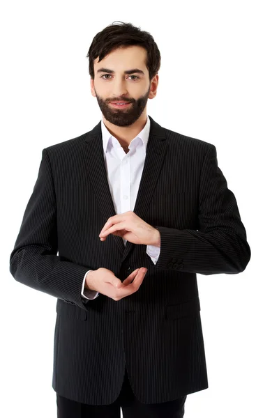 Empresario mostrando el tamaño con las manos . — Foto de Stock