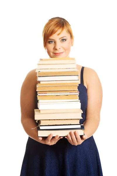 Mulher com sobrepeso segurando livros — Fotografia de Stock