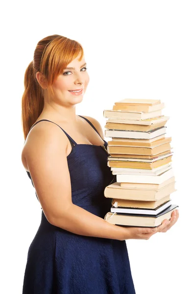 Mulher com sobrepeso segurando livros — Fotografia de Stock