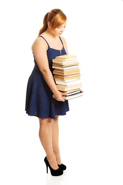 Mujer con sobrepeso sosteniendo libros —  Fotos de Stock