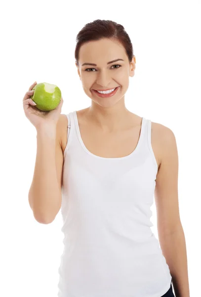 Happy woman holding an apple — Stock Photo, Image