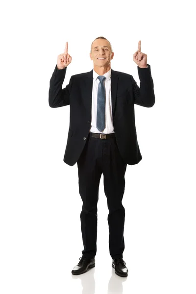 Businessman pointing upwards — Stock Photo, Image