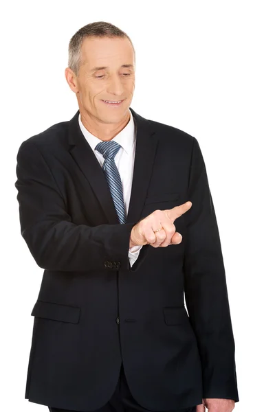 Businessman pressing an abstract button — Stock Photo, Image