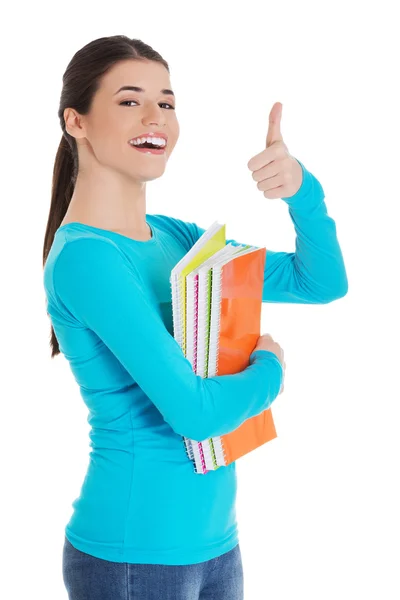 Woman holding notes with thumb up sign — Stock Photo, Image