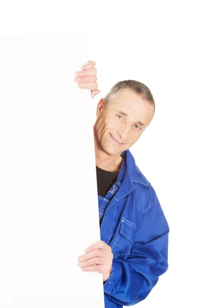 Worker presenting empty banner — Stock Photo, Image