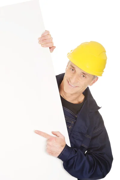 Worker presenting empty banner — Stock Photo, Image