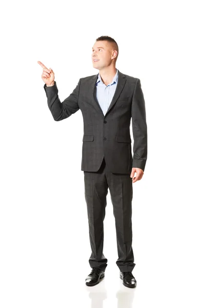 Businessman pointing away — Stock Photo, Image