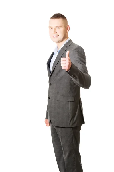 Businessman gesturing thumb up sign — Stock Photo, Image