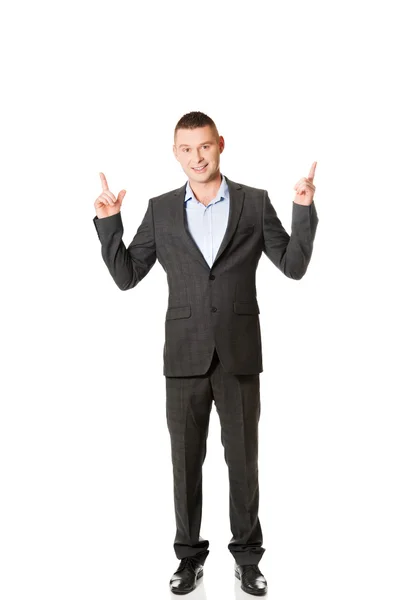 Young businessman pointing upwards — Stock Photo, Image