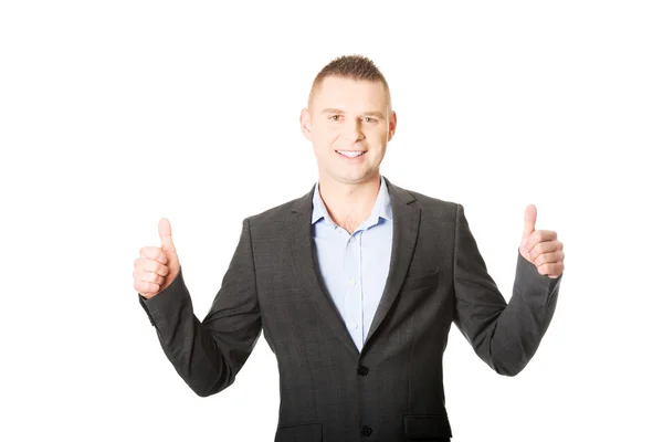 Businessman gesturing thumbs up sign — Stock Photo, Image