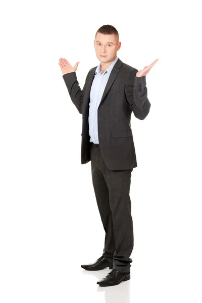 Businessman making undecided gesture — Stock Photo, Image