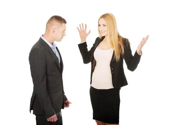 Pregnant businesswoman arguing with her partner — Stock Photo, Image