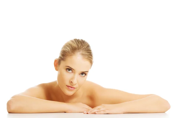 Nude woman sitting at the desk — Stock Photo, Image