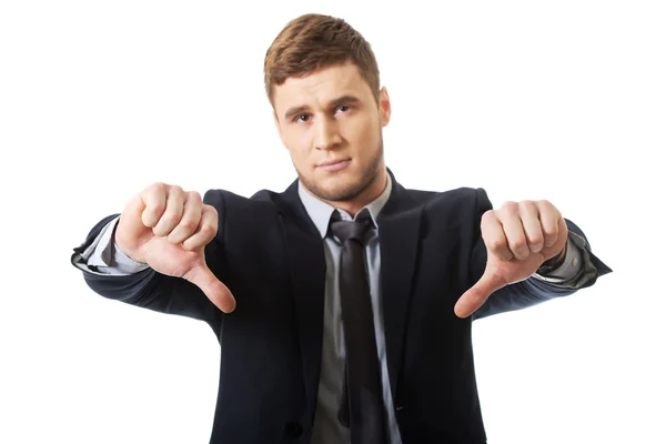 Businessman with thumbs down sign — Stock Photo, Image