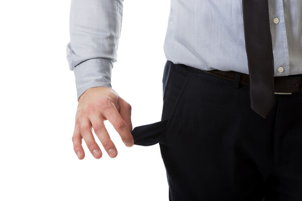 Бизнесмен показывает свои пустые карманы
.