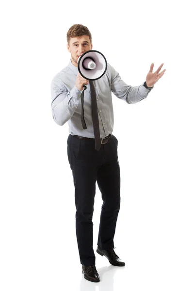 Uomo d'affari che urla attraverso il megafono . — Foto Stock
