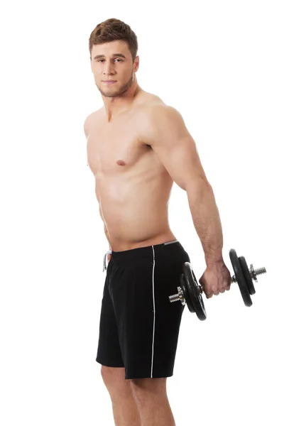 Muskulöser Sportler im Gewichtheben. — Stockfoto