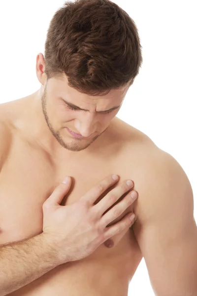 Lekkoatletycznego mężczyzna uczucie bólu w klatce piersiowej. — Zdjęcie stockowe