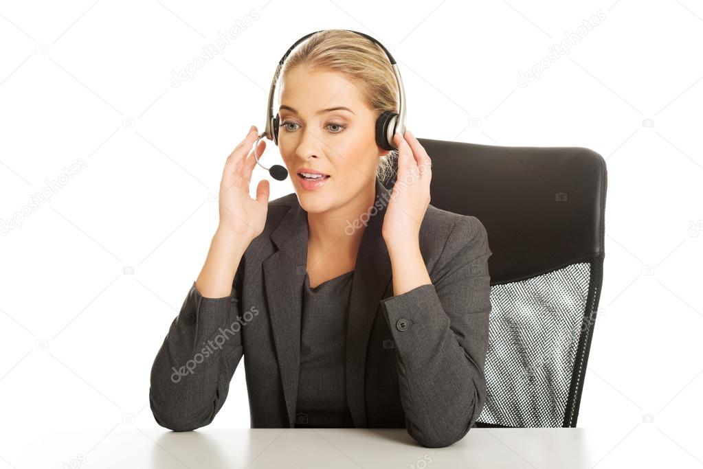 Call center woman sitting at the desk