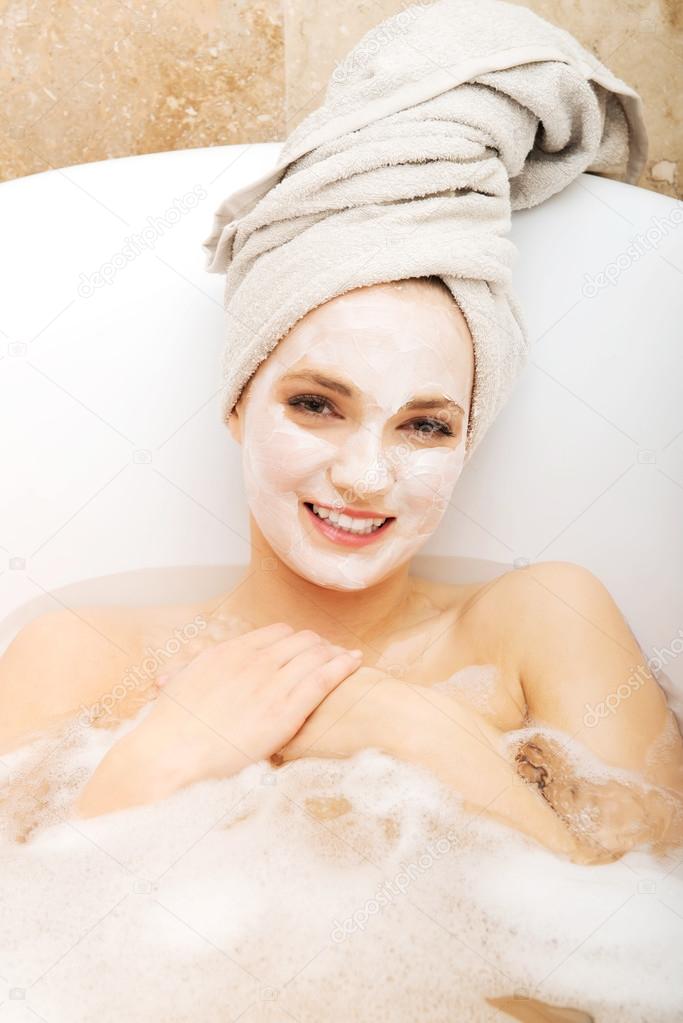 Woman relaxing with face mask.