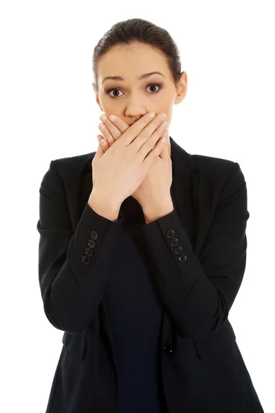 Excited young business woman covering her mouth. — Stock Photo, Image