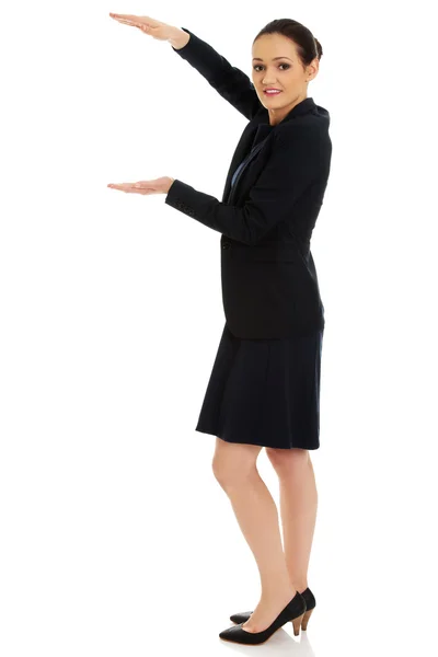 Businesswoman holding copy space in hands. — Stock Photo, Image