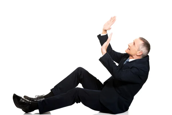 Businessman protecting himself from empty space — Stock Photo, Image