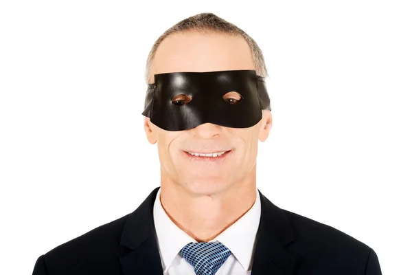 Businessman wearing black eye mask — Stock Photo, Image