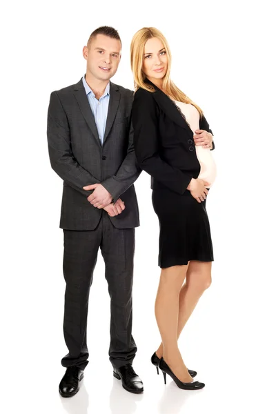 Pregnant businesswoman with her partner — Stock Photo, Image