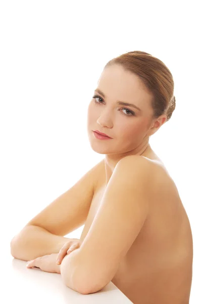 Young spa woman by a desk. — Stock Photo, Image