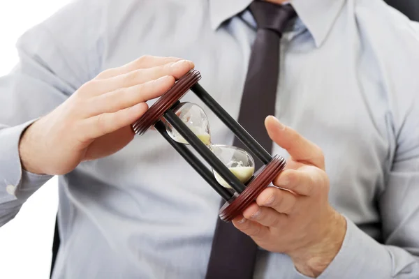 Affärsman anläggning timglas. — Stockfoto