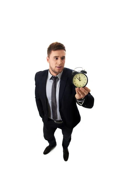 Businessman with alarm clock. — Stock Photo, Image